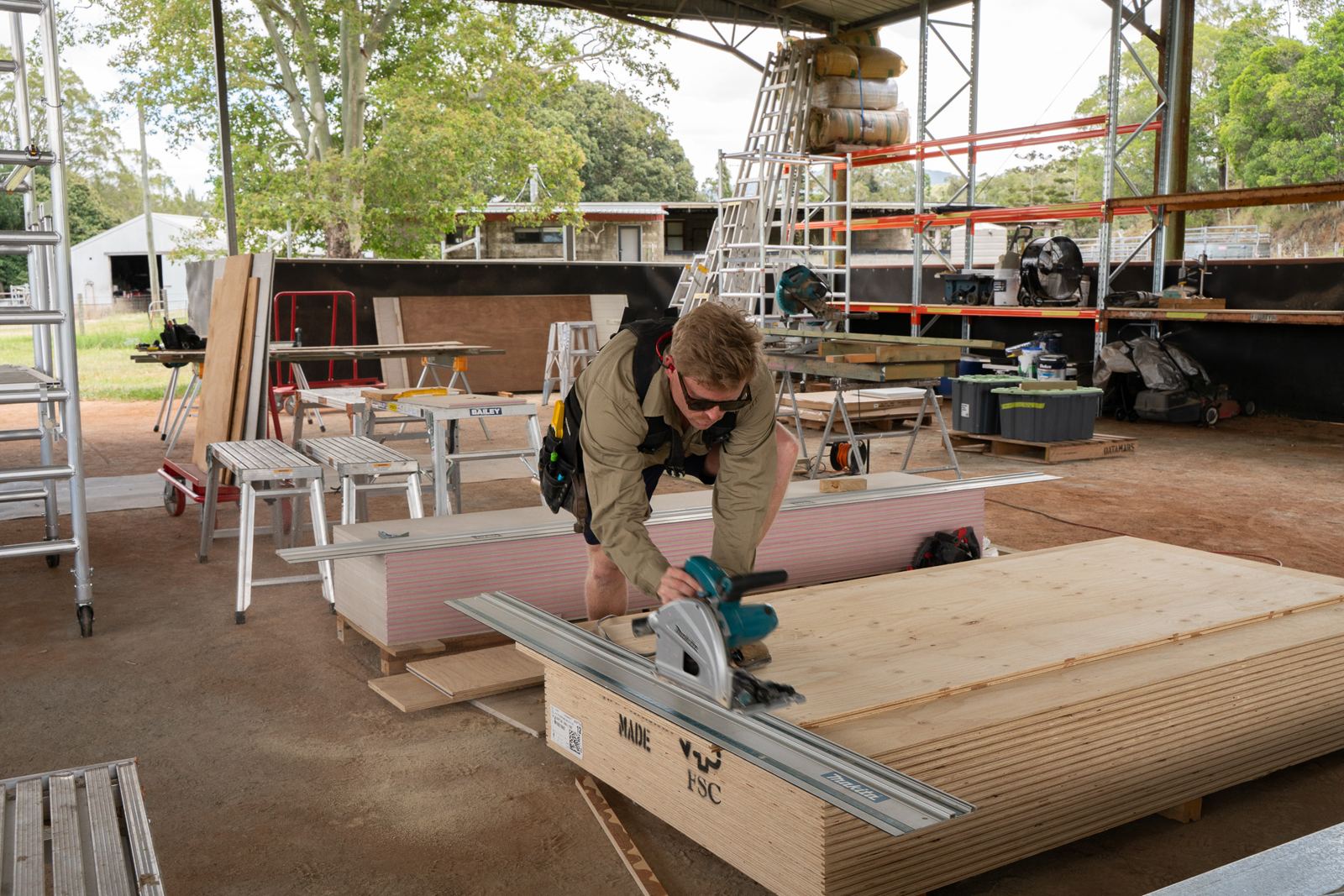 Builder cutting sheet material with a track saw